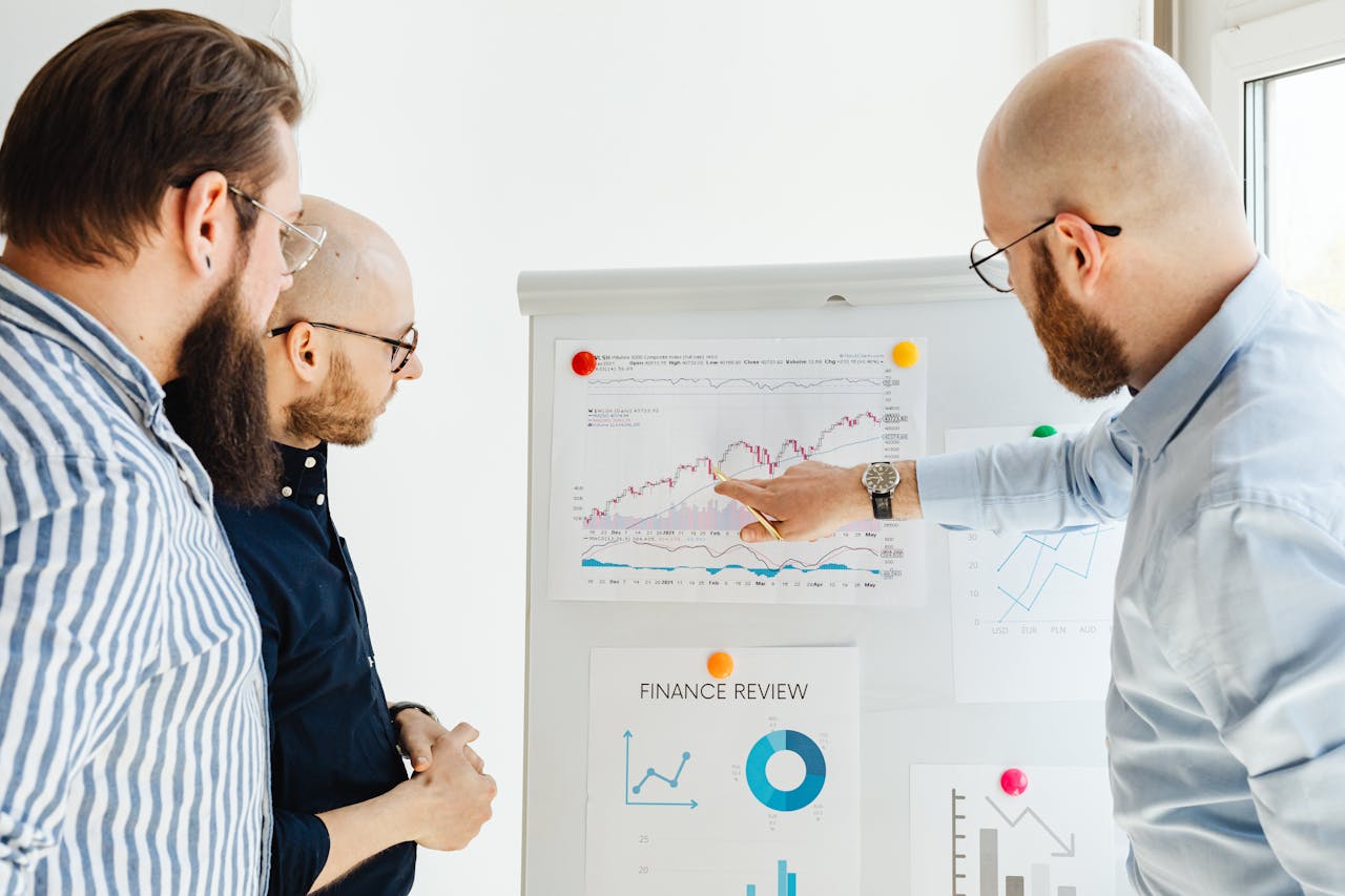 A group of people looking over information on how to value a credit card processing portfolio