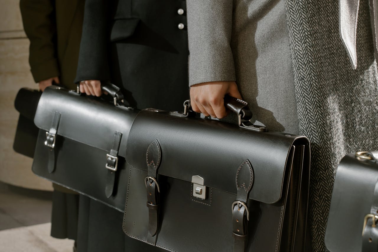 A group of people with suitcases wanting to maximize the value of a sales portfolio