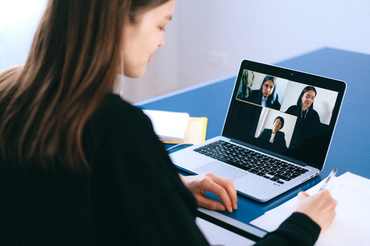 Someone using a laptop to take a video call