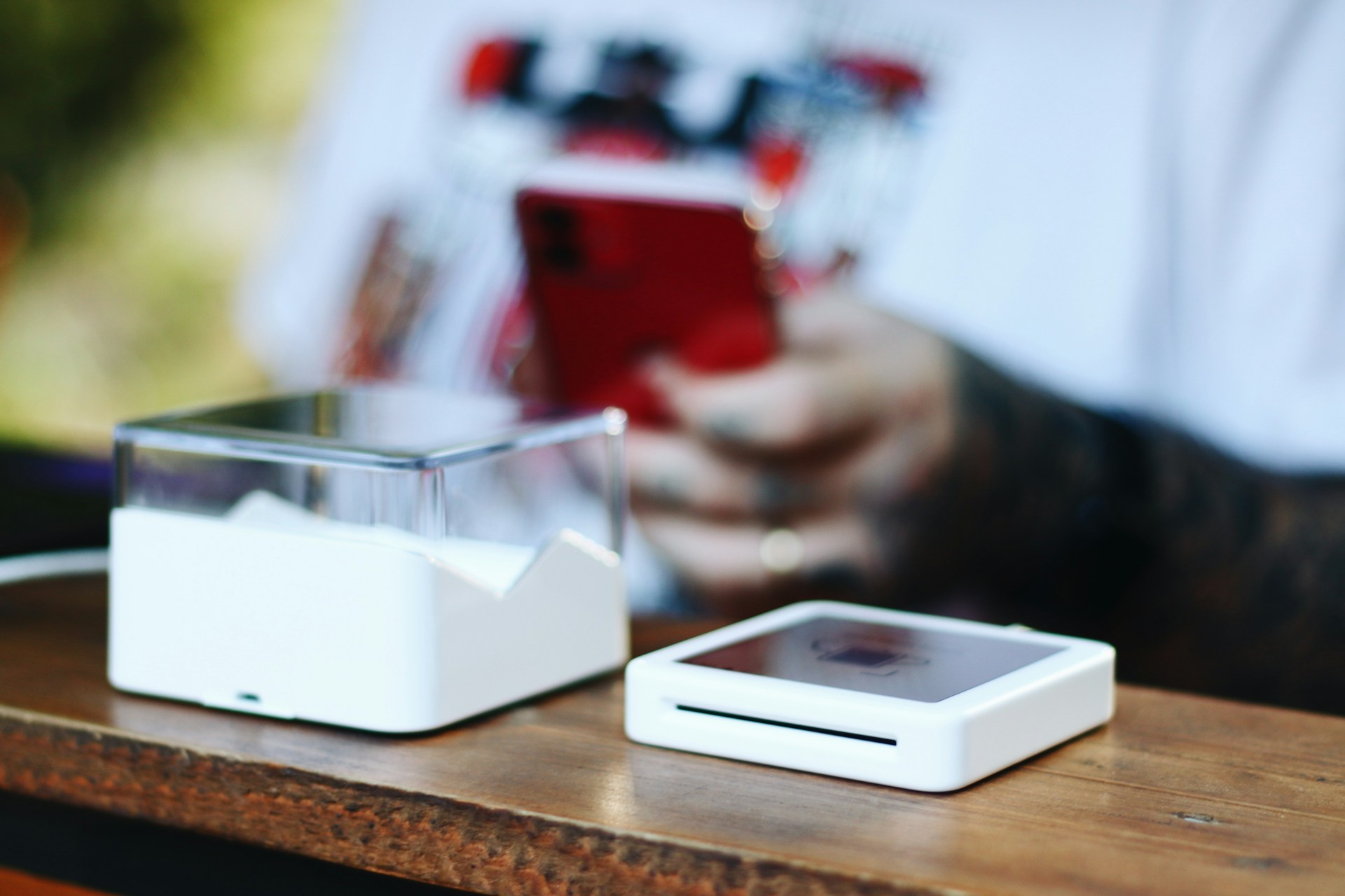 A person using their smartphone for help with merchant portfolio optimization