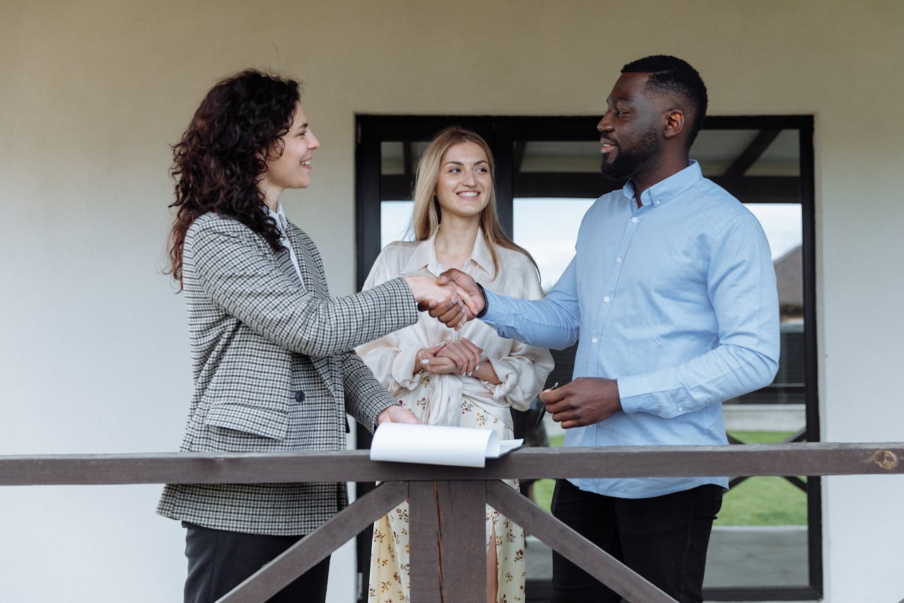 A group of three people discussing key strategies to get the best deal