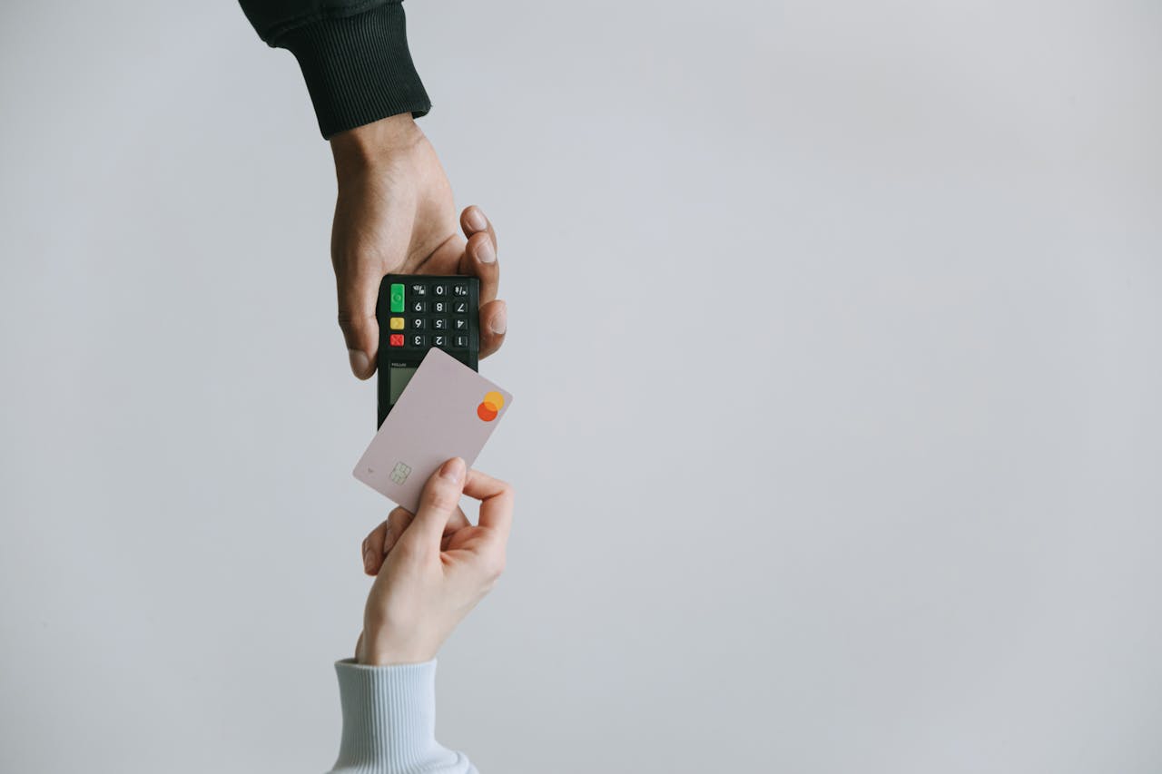 A person paying for something with a credit card
