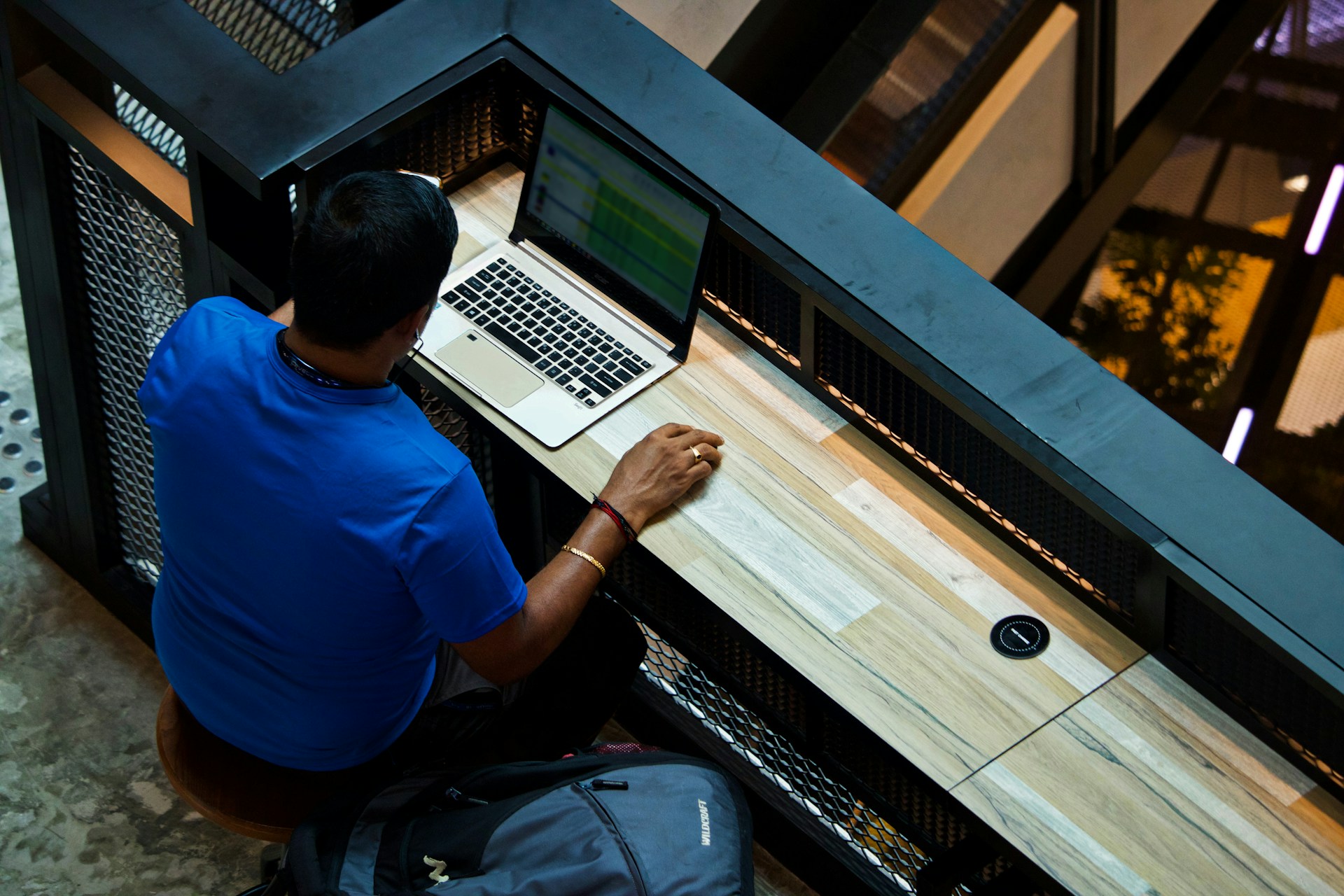 A person using a laptop to learn how to evaluate a portfolio buyout offer