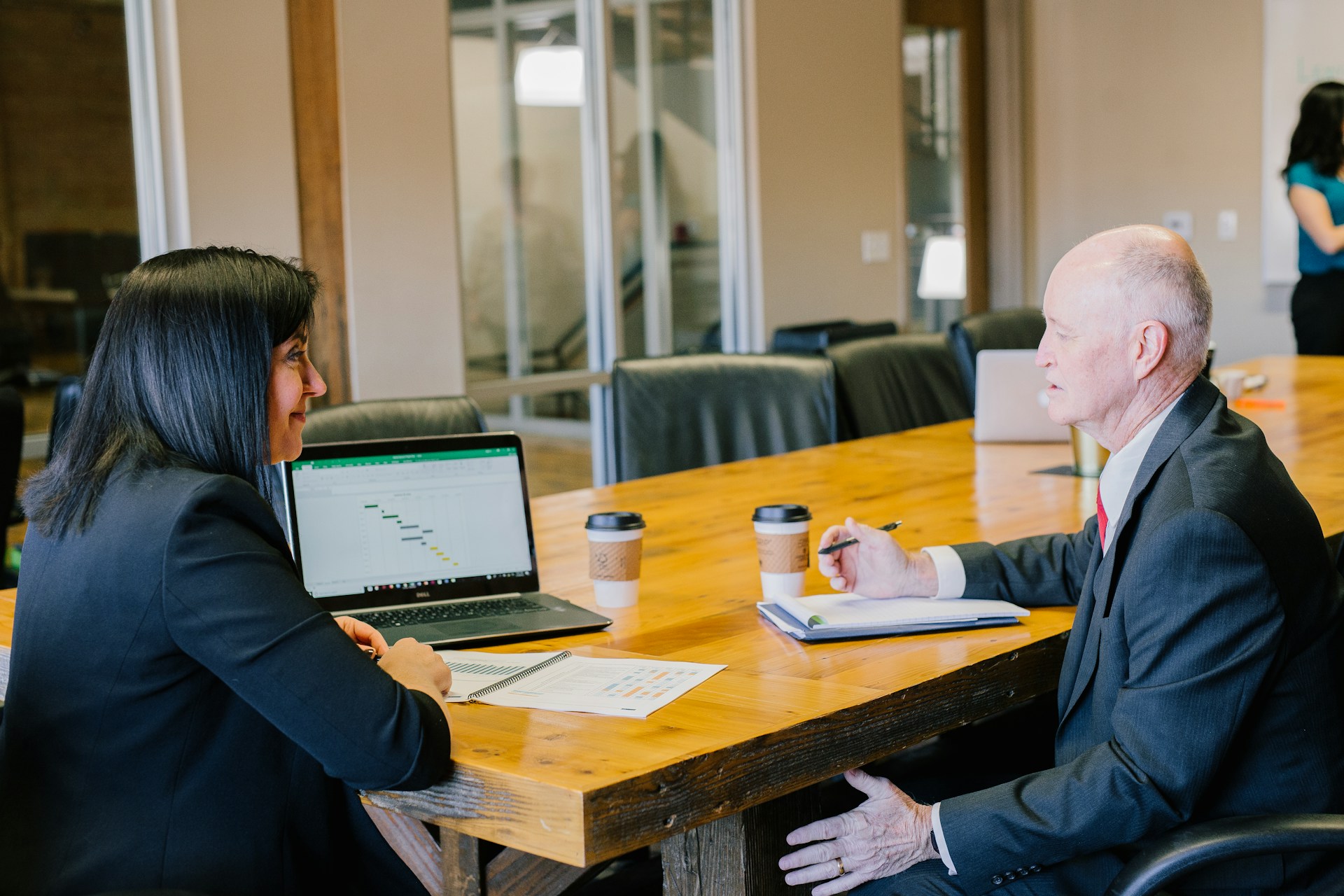 A woman explaining how to choose a payment processor to a client