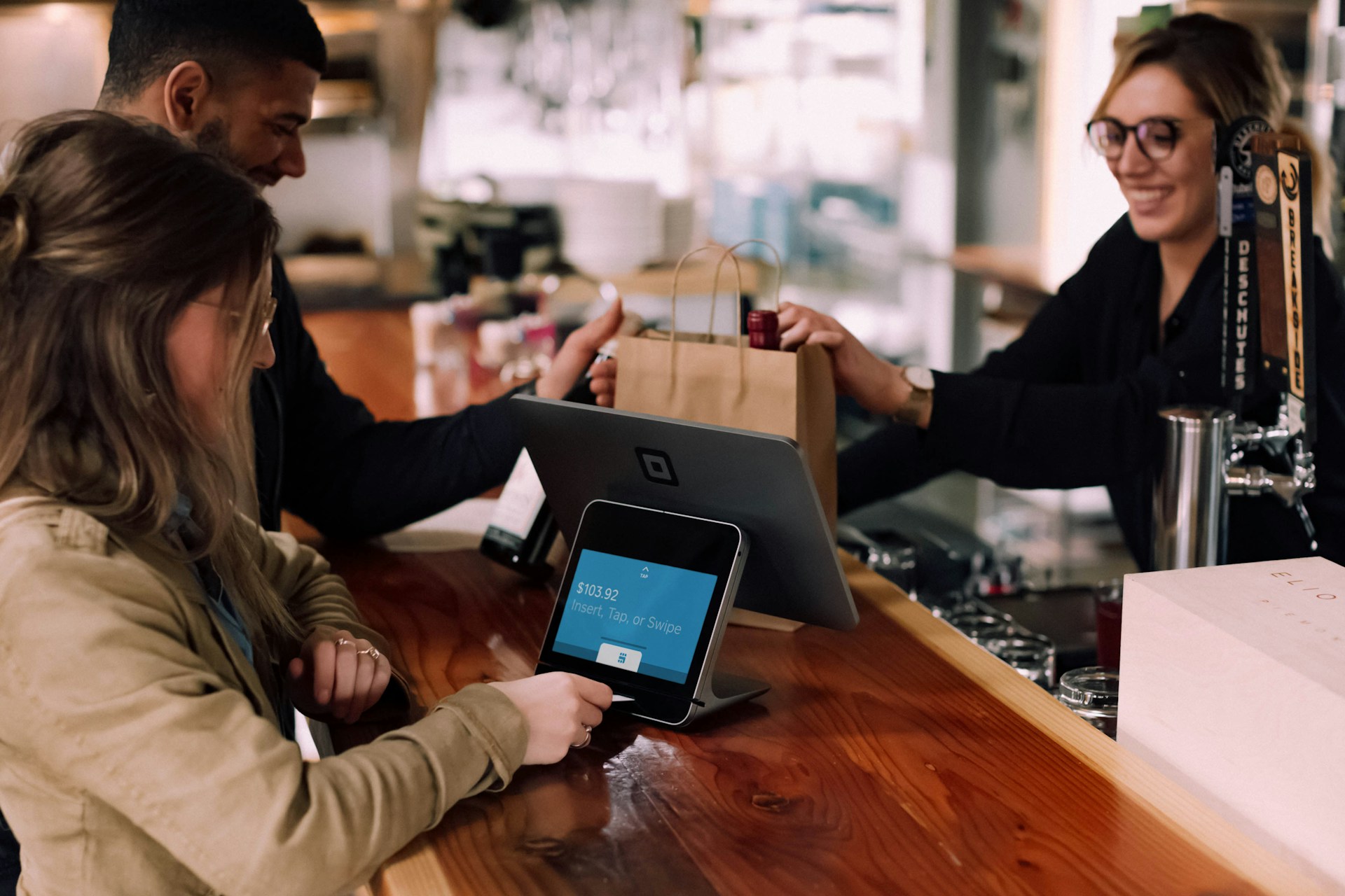 A customer paying for their order with a credit card